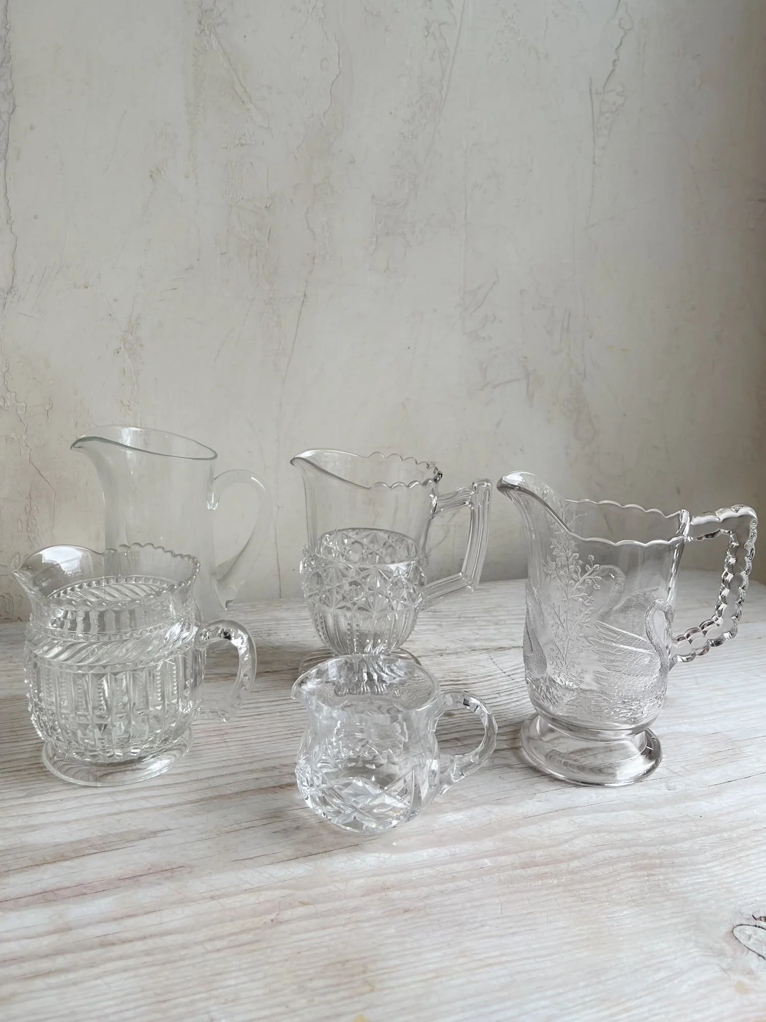 vintage-etched-pressed-embossed-glass-pitchers.jpg