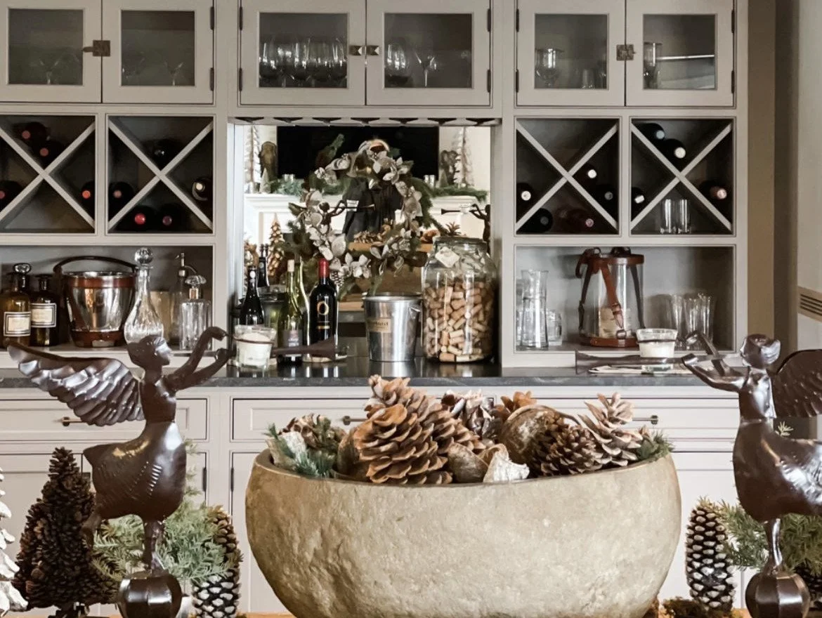 holiday party bar setup angel statues pine cones