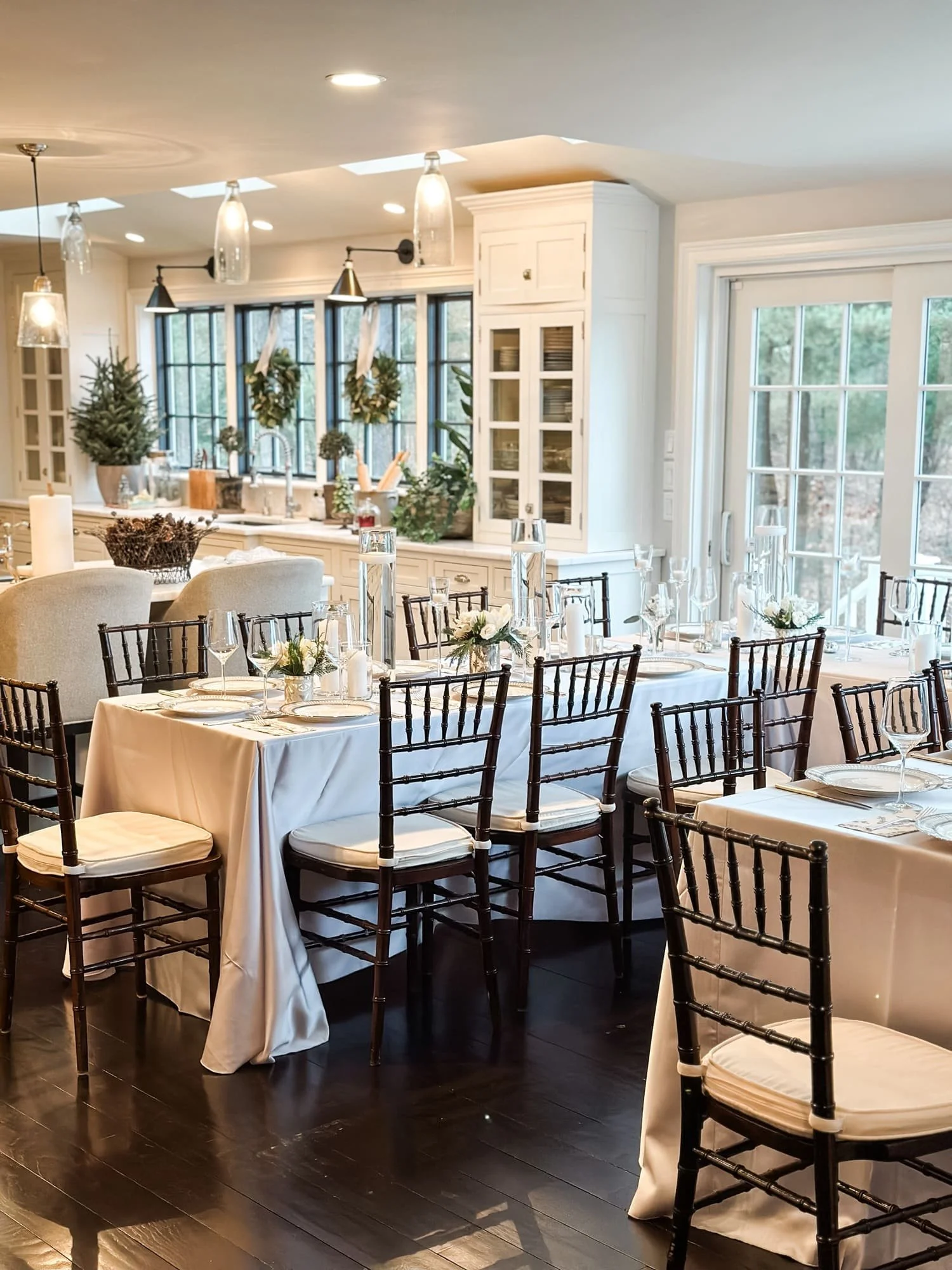 holiday table setting formal dinner table floral centerpiece window wreaths