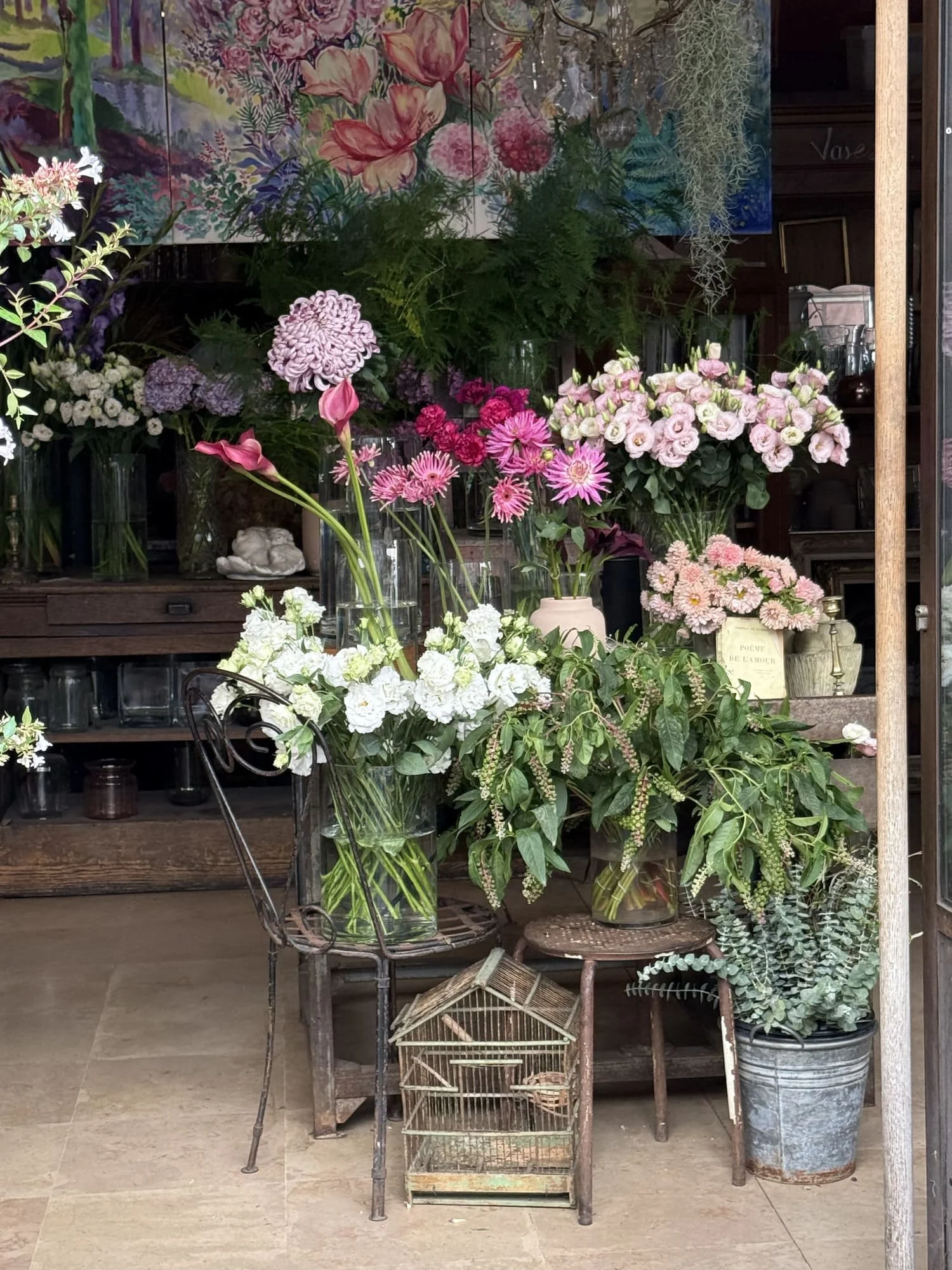 paris flower shop pink and white flowers bird cage
