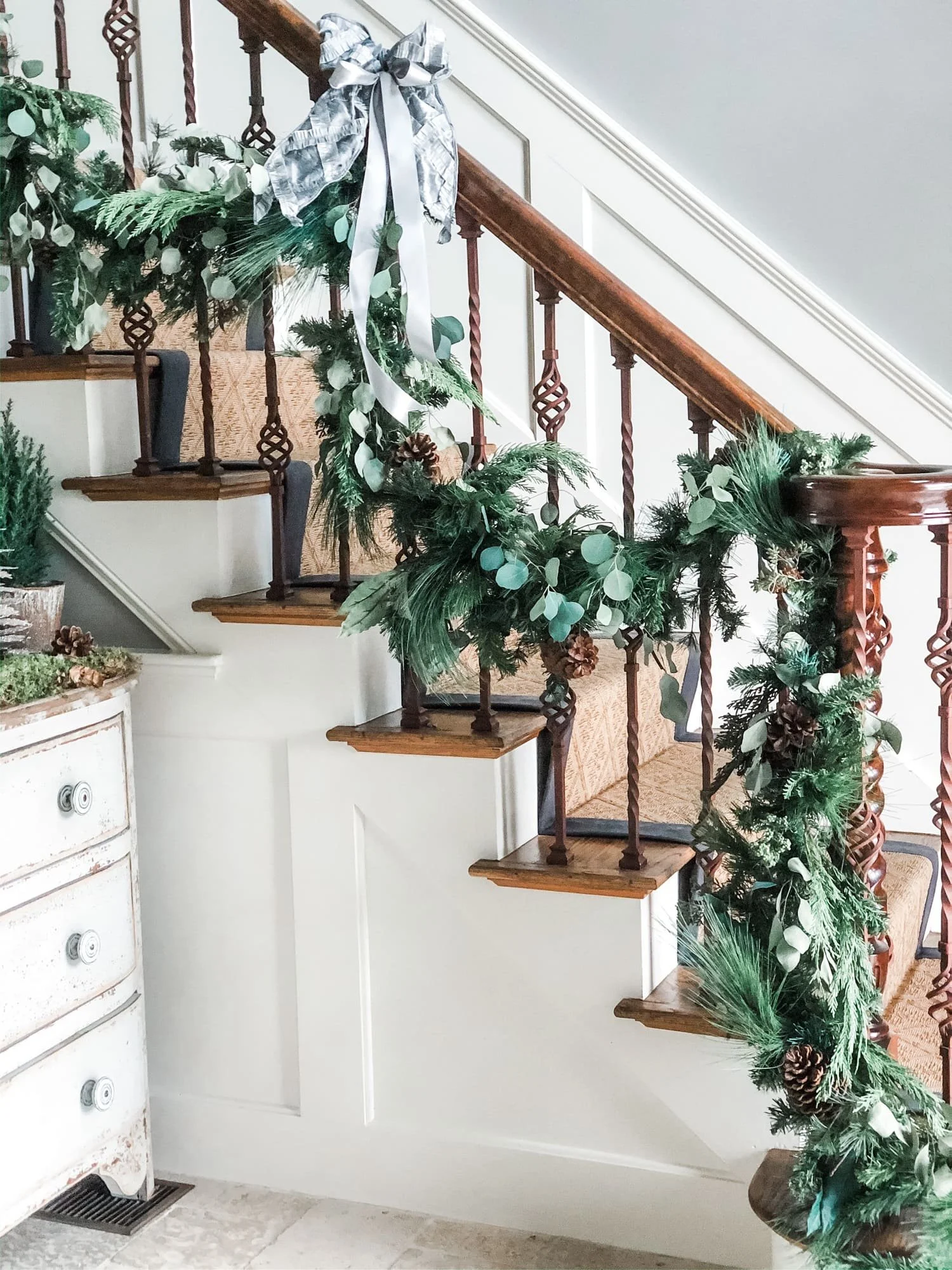 winter greenery garland wrapped stair bannister christmas decorations at home