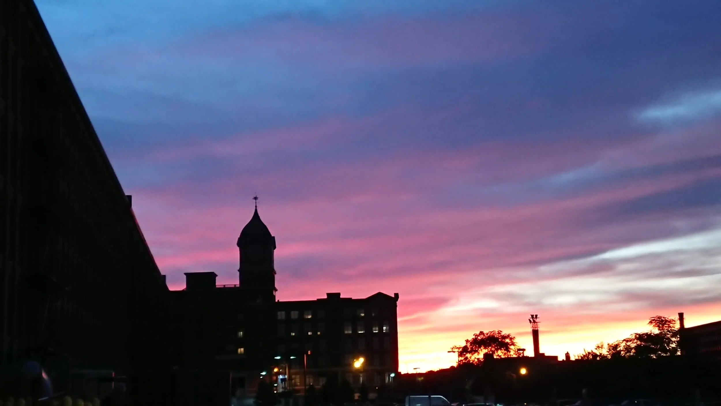 Photo of the City of Lawrence, Massachusetts showing historic mill buildings at Riverwalk where Station1 is located.