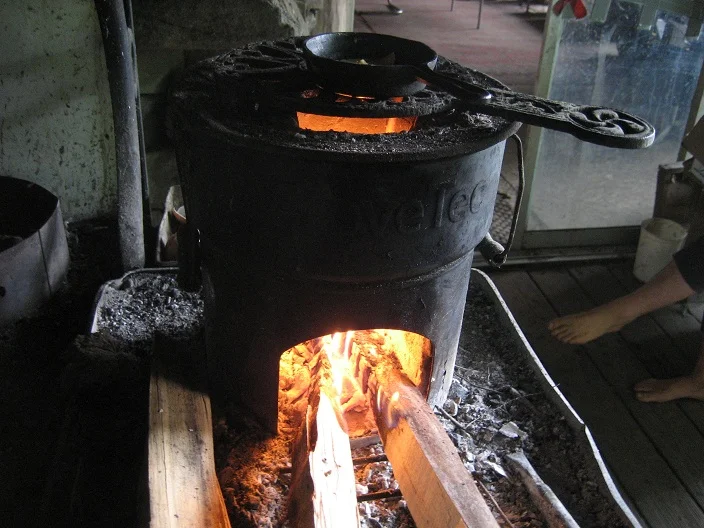Rocket stove, with our first chanterelle in the tiny frying pan