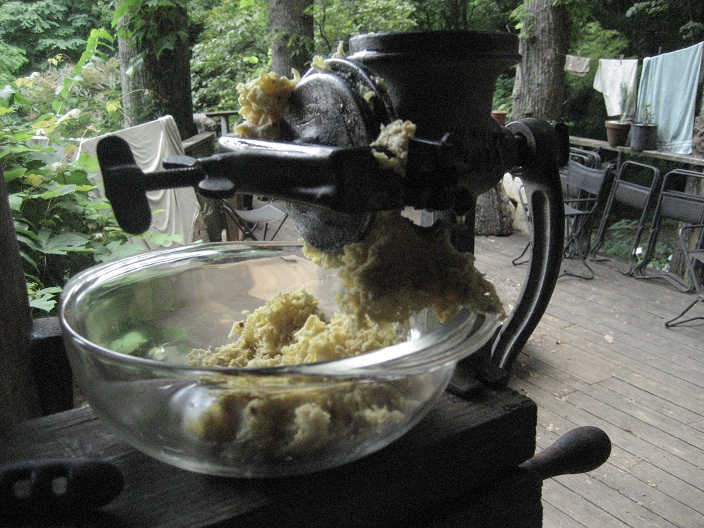 Corn in the hand-crank grinder