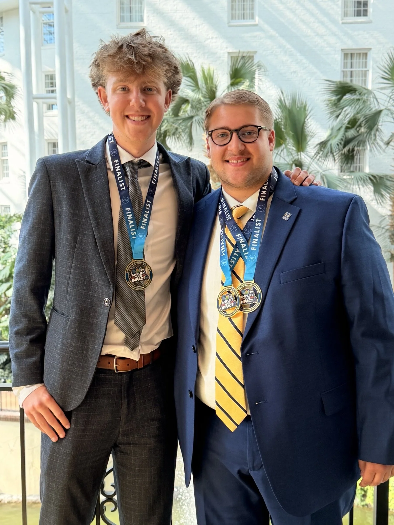 Aidan Leslie and Collin Ridgway wearing their award medallions 2026 NLC.jpeg