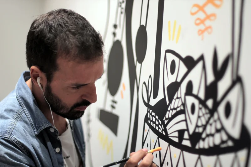 Artist Ruben Sanchez painting onsite at Salero