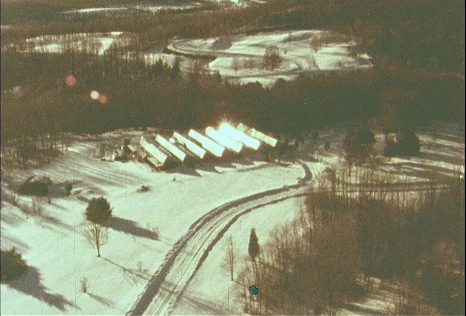 A Building in the Sun solar powered building in snow and forest.jpeg