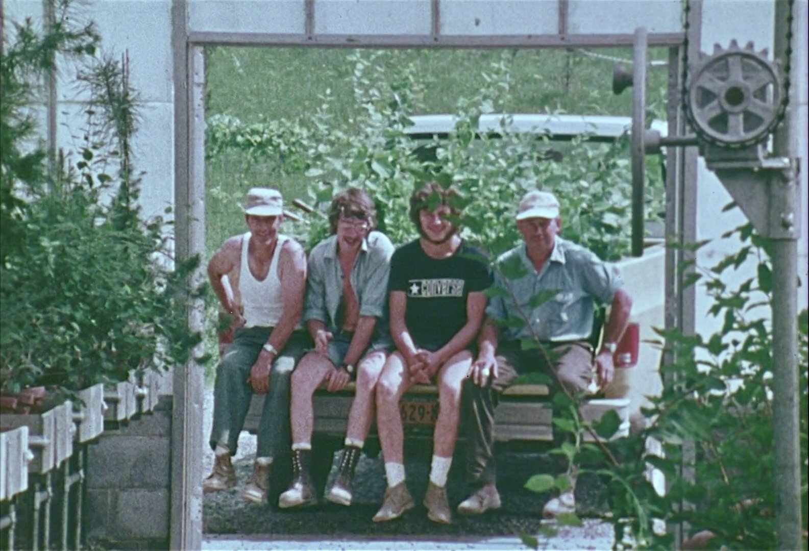 A Gift of Land men 1977 in conservatory.jpeg