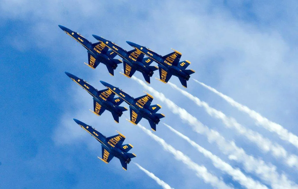 6 Blue Angel fighter jets flying in formation at an air show