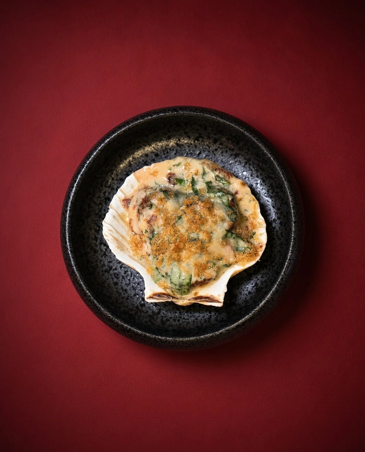 Scallops Rockefeller with garlic crumb and Parmesan, baked in the shell