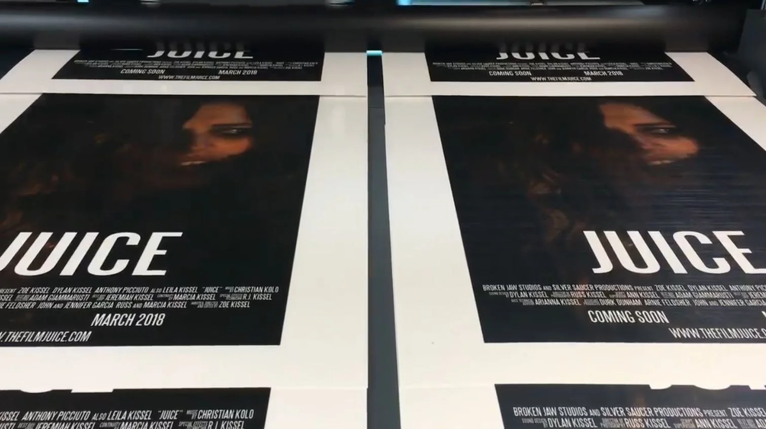 Official Juice posters in the process of being printed.