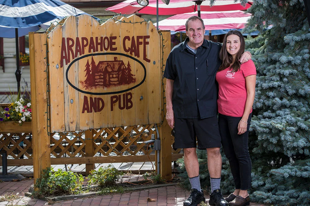 owners-doug-and-bonnie-smiling-out-in-front-of-the-arapahoe-sign.jpg