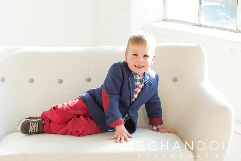 little-guy-in-red-white-and-blue-sits-on-couch