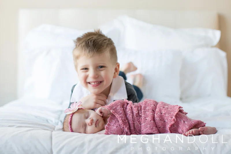 big-brother-smiles-with-new-baby-sister
