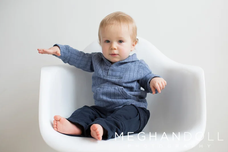 one-year-old-boy-in-chair-wearing-blue