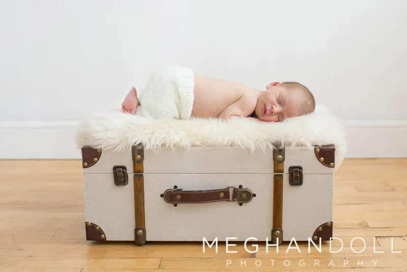 newborn-boy-on-suitcase