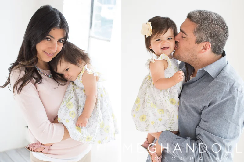 mom-and-dad-snuggle-their-one-year-old-girl