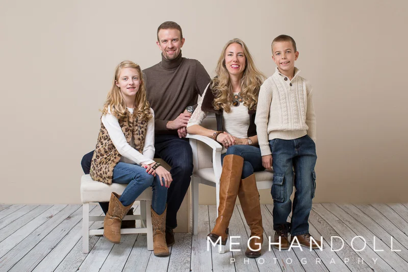 family-of-four-smile-in-brown