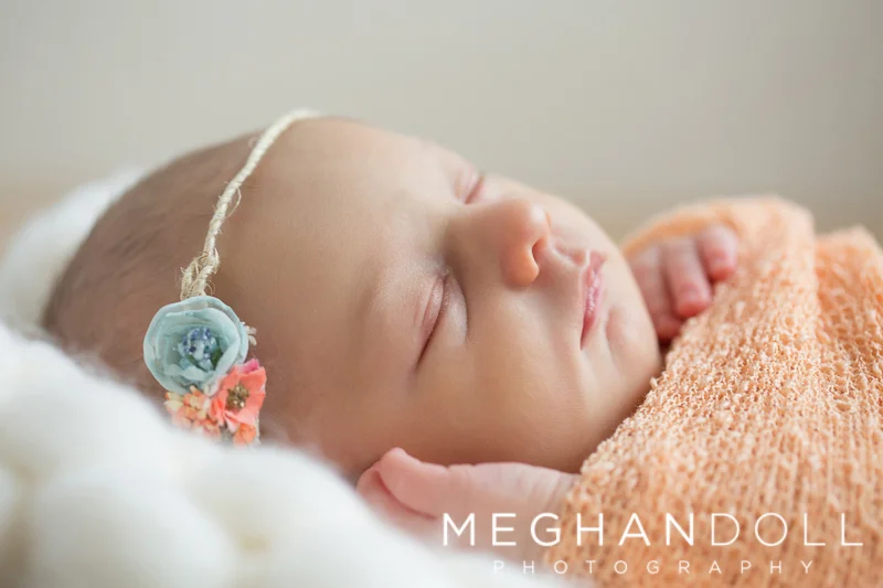 close-up-of-newborn-girl-in-orange