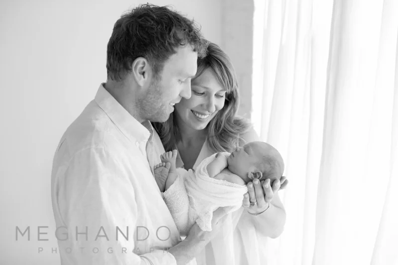 mom-and-dad-looking-at-baby-brother