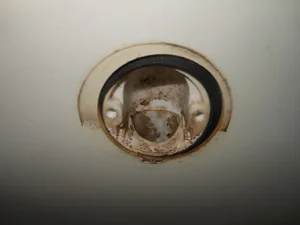 What is behind your overflow hole cover?