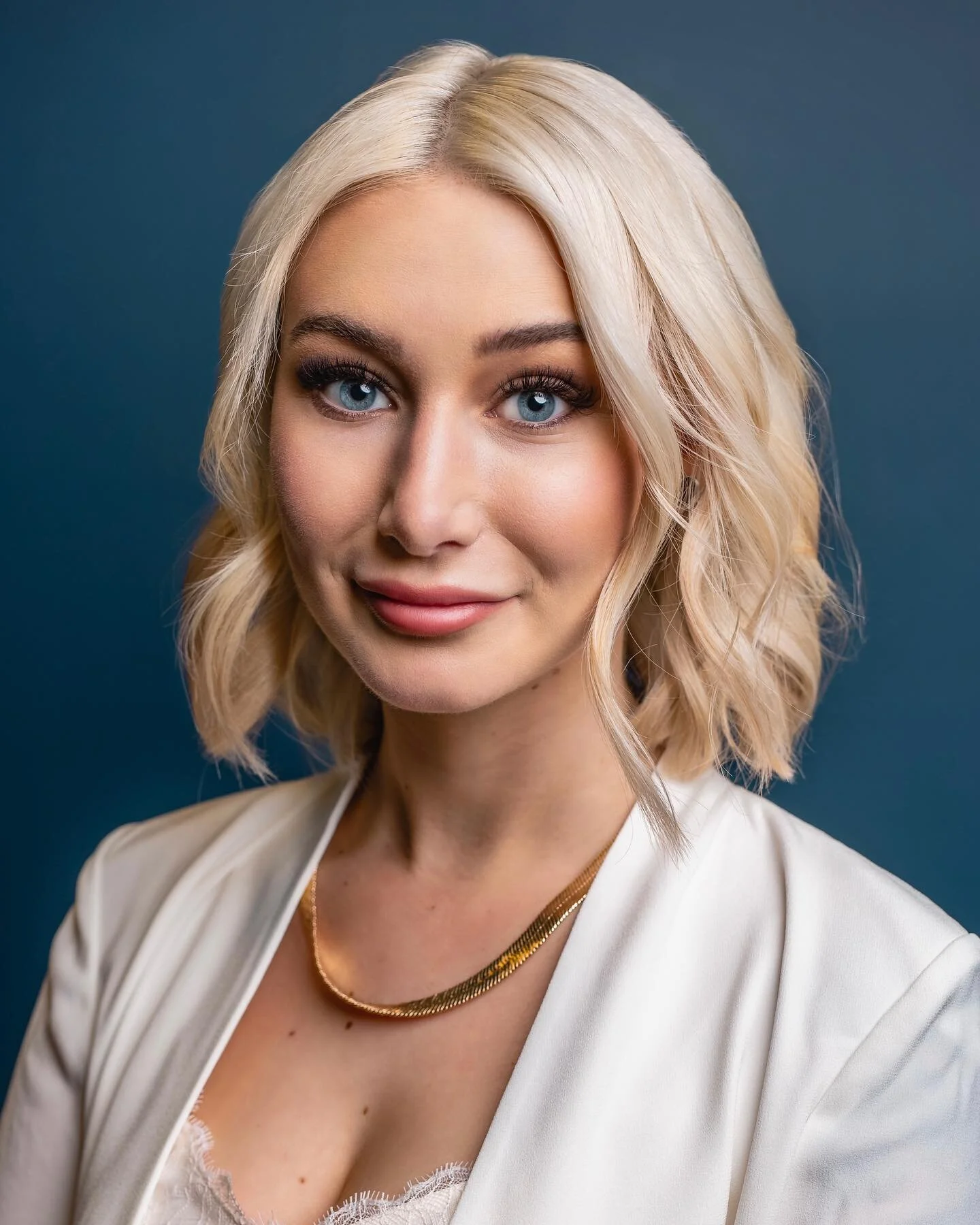 Headshot for Keyanna of @yyj.realestate.

We got pretty lucky during this shoot that Keyanna&rsquo;s work office had this solid blue wall for a backdrop. I had to take a giant framed photo off the wall with the words &ldquo;if you break it, you buy i