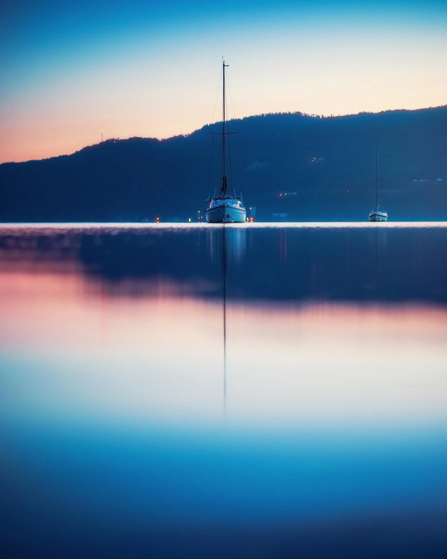 The Divide.

Taking this shot was kind of hilarious, to be honest. There was enough of a current that the sailboat would gradually turn, so I ran up and down the shoreline trying to line this up well enough for this composition! @grahamwhat laughing 