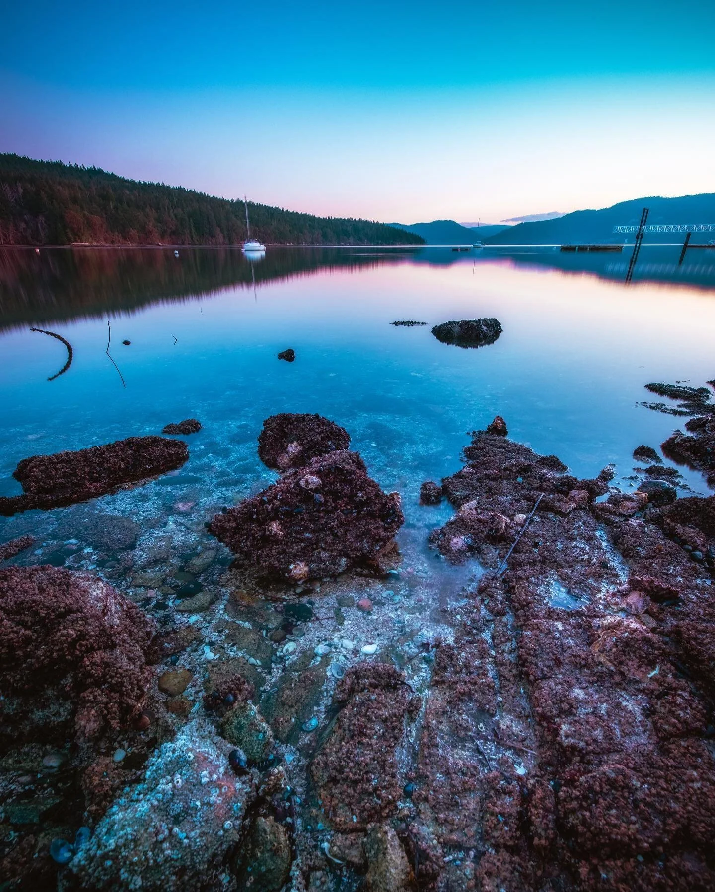 Silky Smooth.

Getting a long exposure over slightly rippling water is so rewarding. The water was already so close to being smooth so shooting for 30 seconds just solidified that effect. I was hopeful that the clouds were gonna be around this evenin