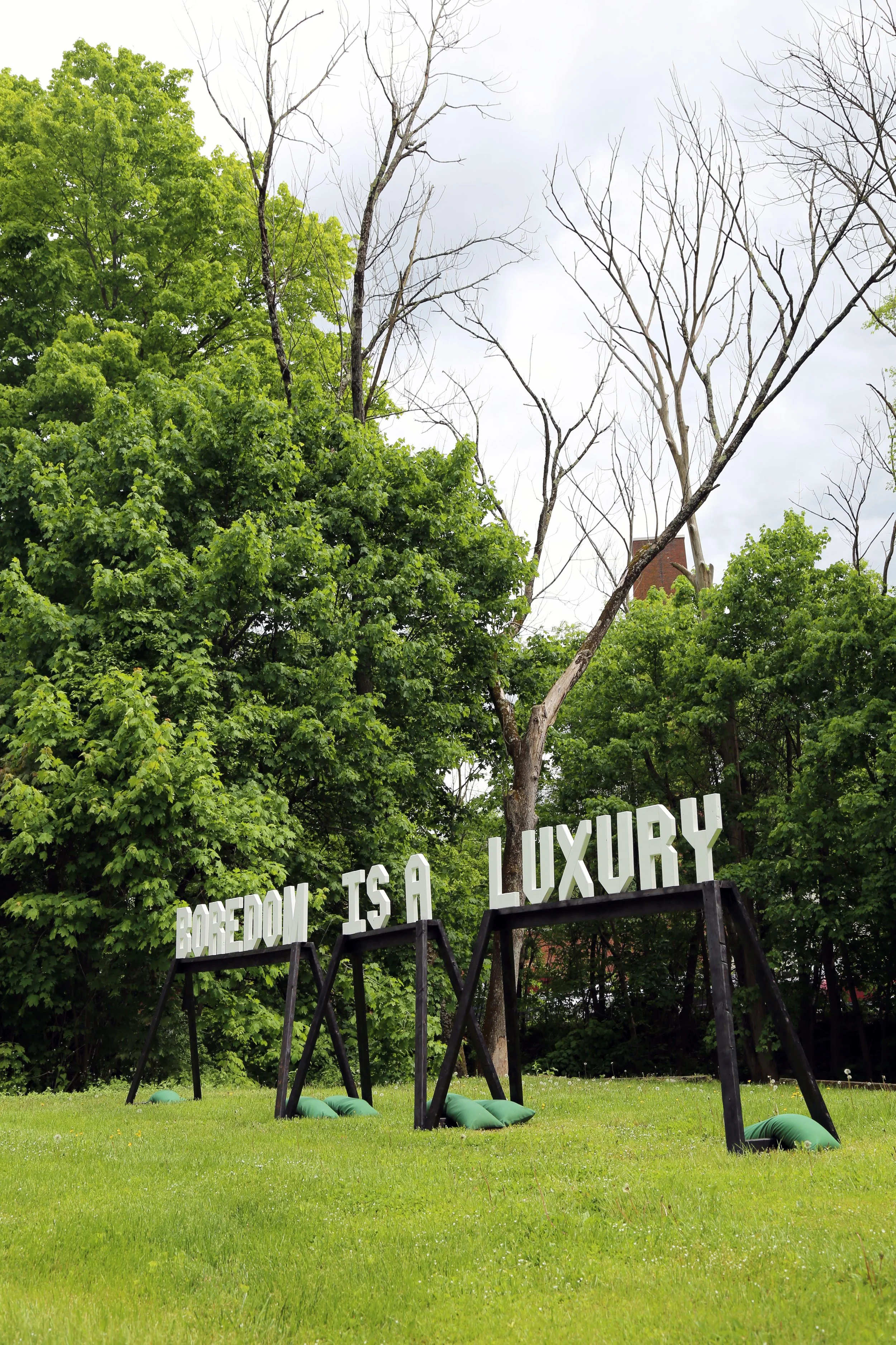   BOREDOM IS A LUXURY,  252" length x 84" depth x 71" height, wood, acrylic paint, 2024 