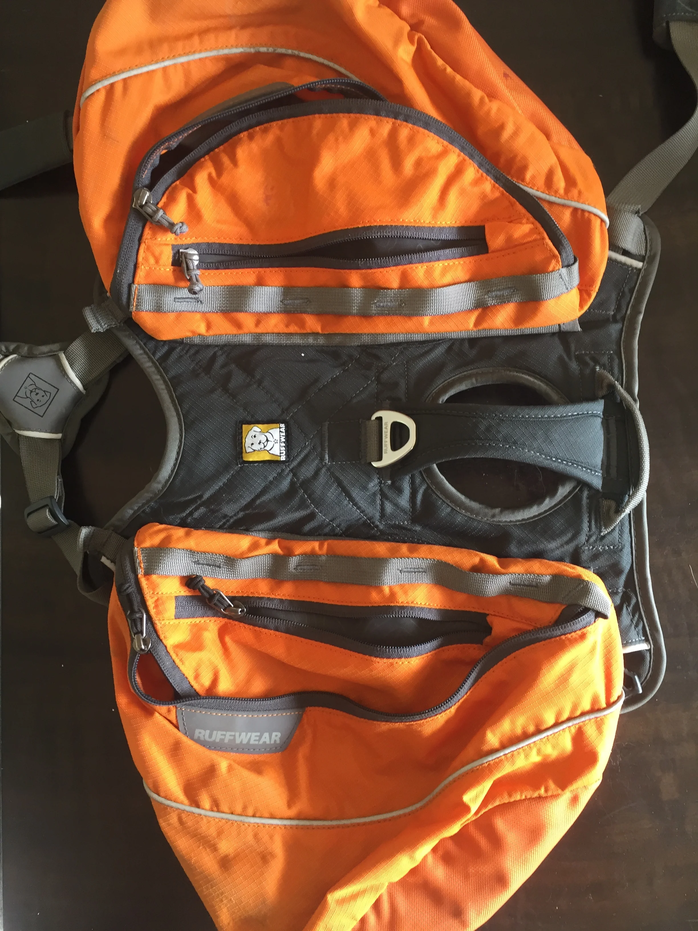 Showing off the multiple compartments of the backpack, also the handle feature. Osa wears a Medium, Jasper wears a large. 
