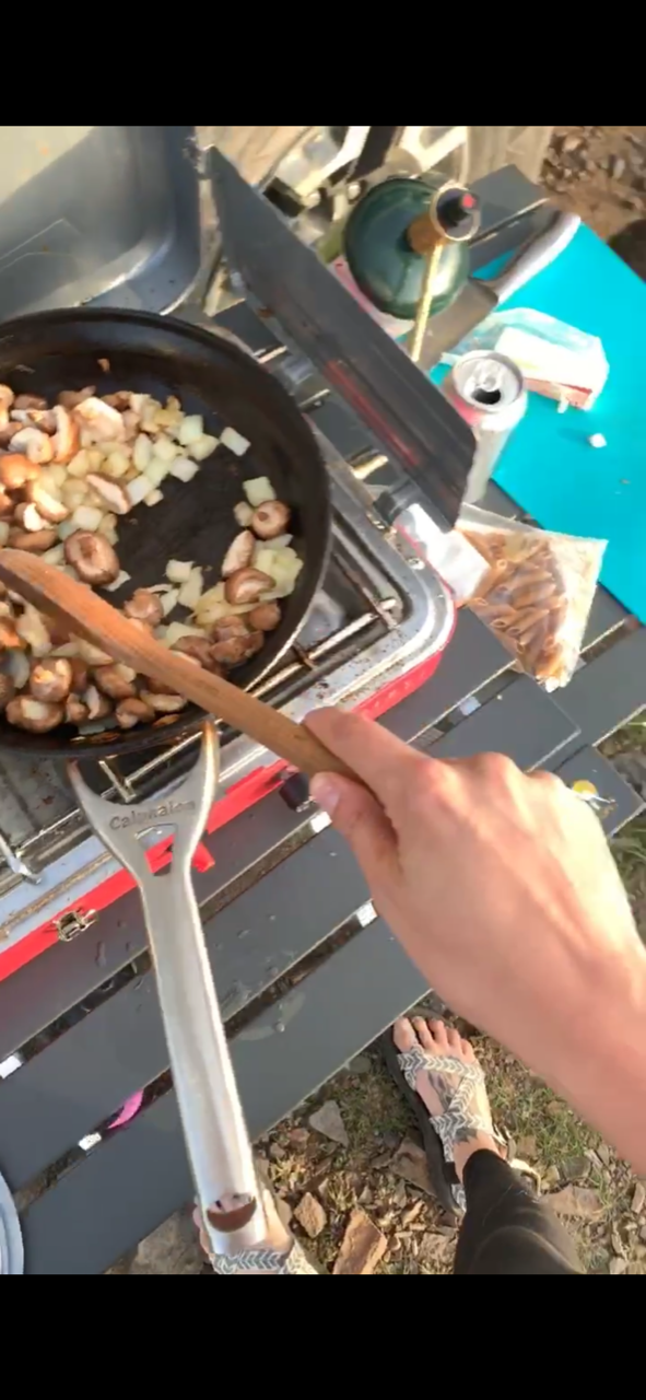 Poor quality image of the mushroom + onion mixture sautéing.