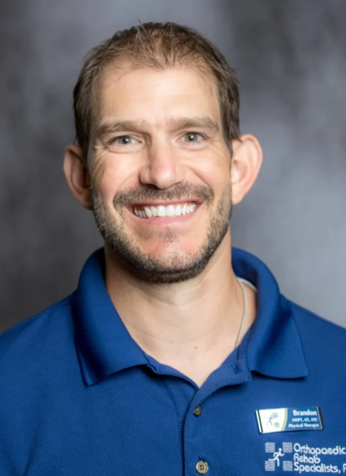 Brandon Klump MSPT, AT, ATC Vice President of Finance Clinic Director Foot, Ankle & Running Center of Jackson Brandon is a co-owner and Physical Therapist. He has been with ORS since 2003 and is a graduate of Alma College with a Bachelor’s Degree of Science in Exercise and Health Science. He then completed his Master’s Degree in Physical Therapy at Washington University in St. Louis. Brandon’s clinical interests include orthopedics and sports medicine, and performance training. He is married to his wife, Emily and they have four boys named Brogan, Lucas, Graham, and Andrew. Brandon enjoys running, soccer, golf, and is active in his church.