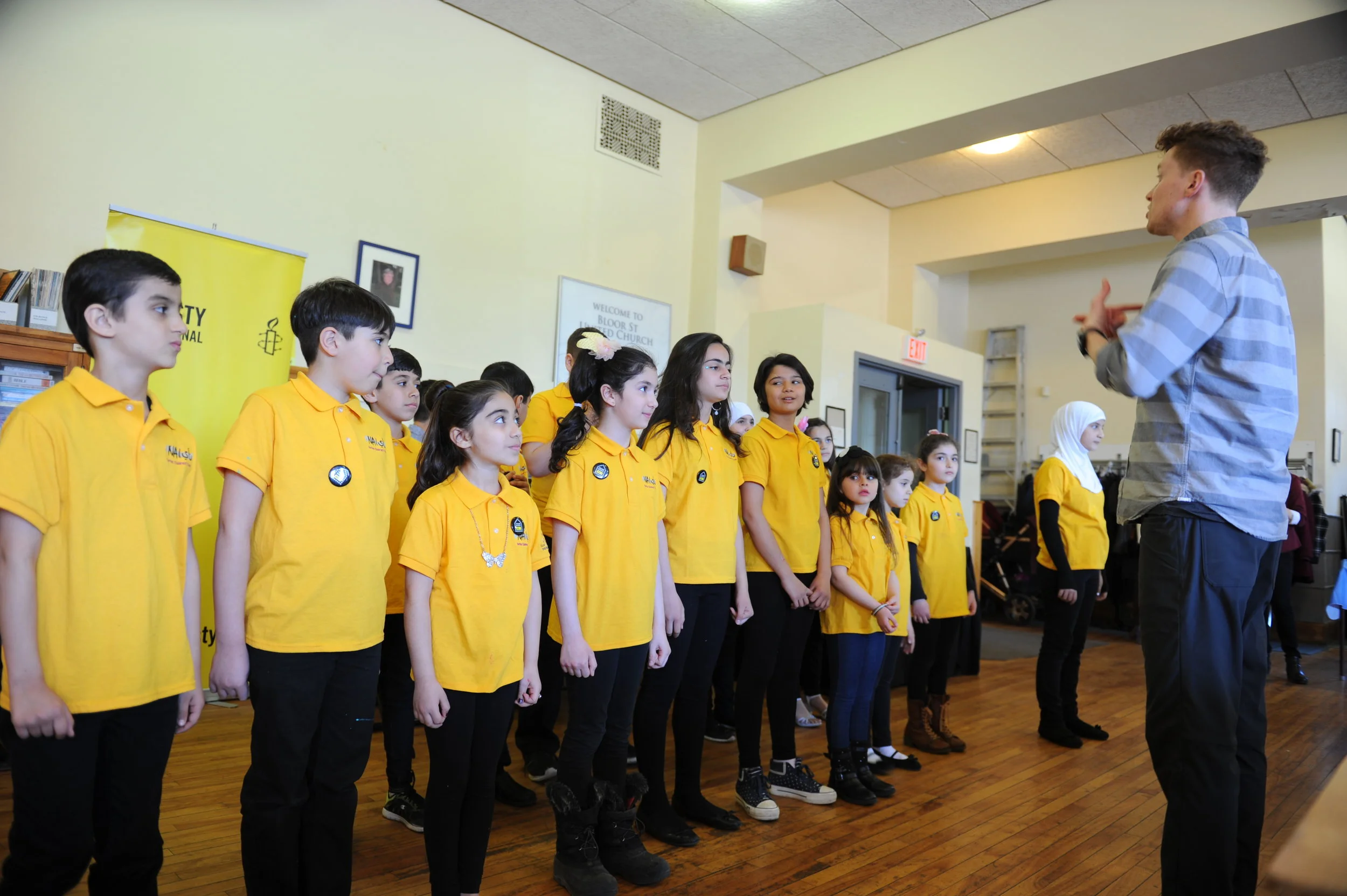 RPSM teacher Lucas directed the choir at the Refugee Day Concert 2017