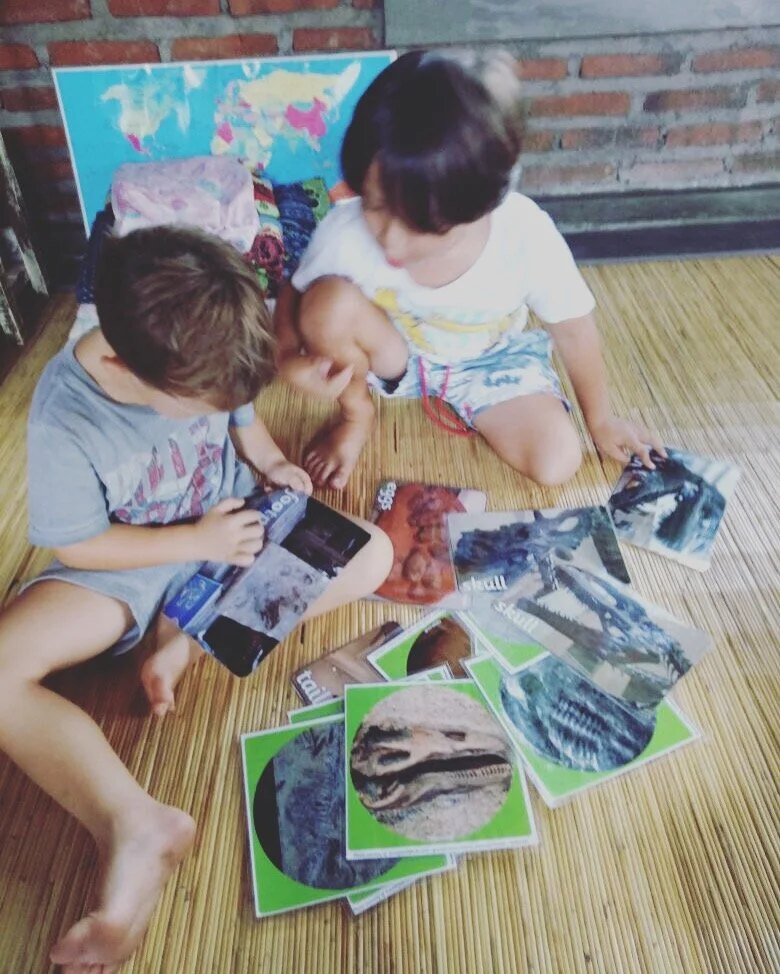 Beni with his friend Rio, at the Bali school researching dinosaurs.