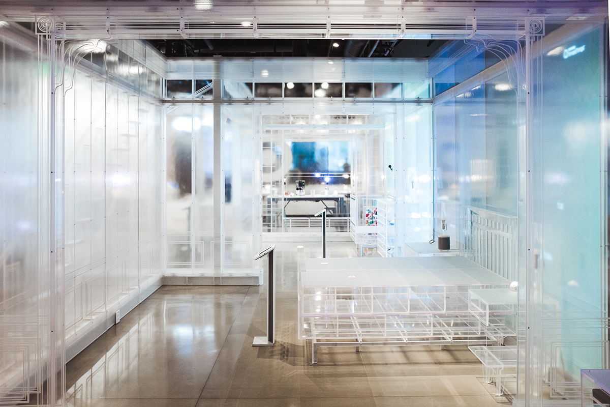 The final store design features two distinct spaces. Shown here is the interior of the "vignette space" which features an acrylic house and furniture, digitized with a full, 3-room projection wall to tell interactive stories and educate guests about