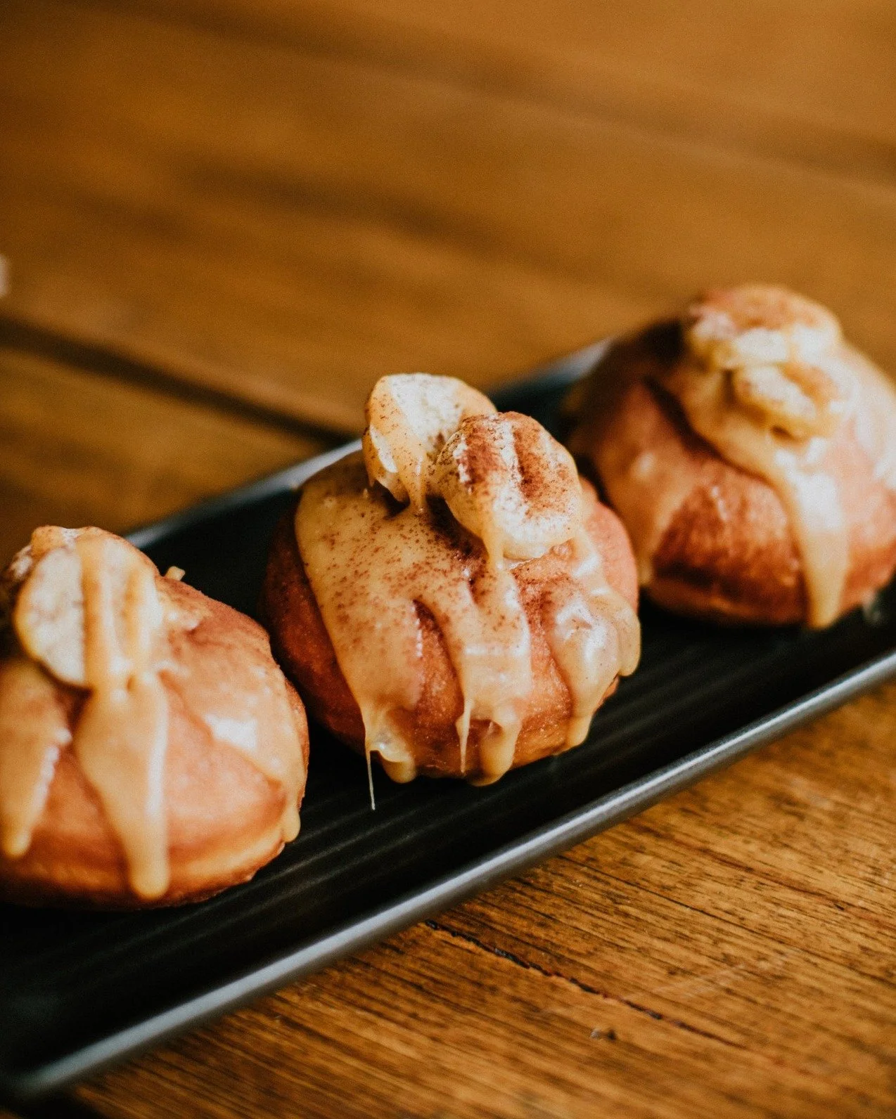 We've got Banoffee Doughnuts today (with a caramel and banana filling, and topped with a caramel glaze, and a banana crisp), as well as our famous Jam, Cinnamon, Lemon Curd, and Baby Sprinkle, and our Cinnamon Gluten Free Doughnuts! All available fro