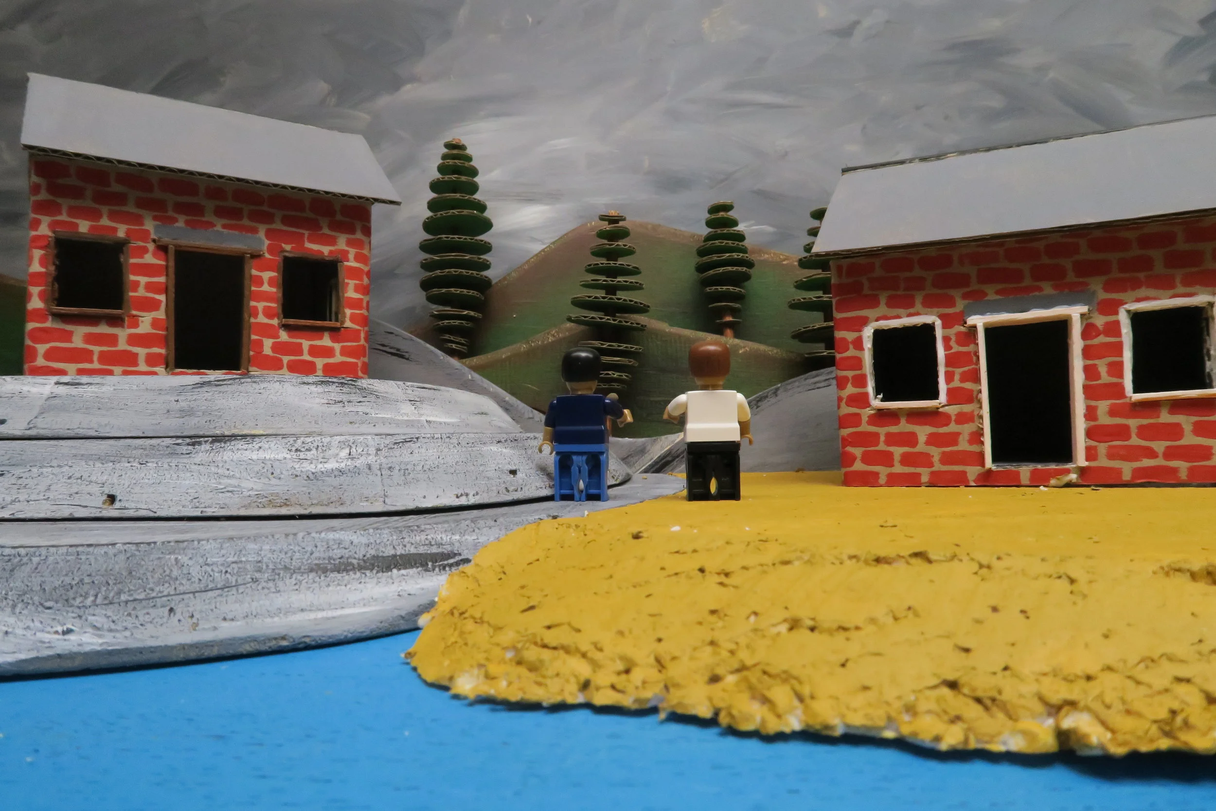   SLIDE 9  The builders both stood back and admired their handy work. They had been so busy they hadn’t noticed the dark clouds appearing. It looked like there was going to be a storm. Time to move into the safety of their lovely new homes. So in the