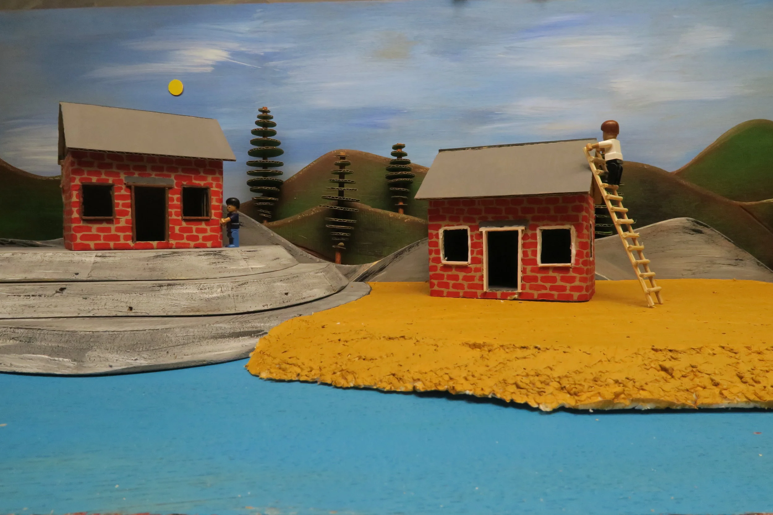   SLIDE 7  With all of the brickwork completed it was time to get the roof on. The houses both looked well built. 