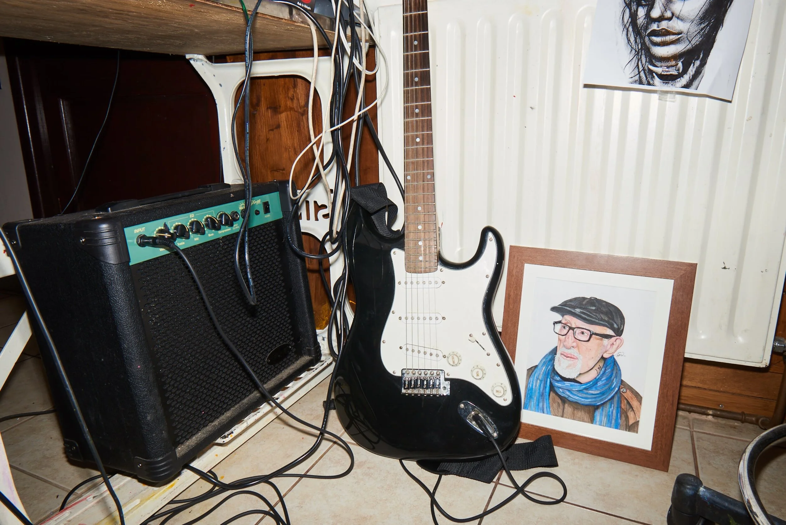 Guitar and painting in Doc Price’s tattoo shop