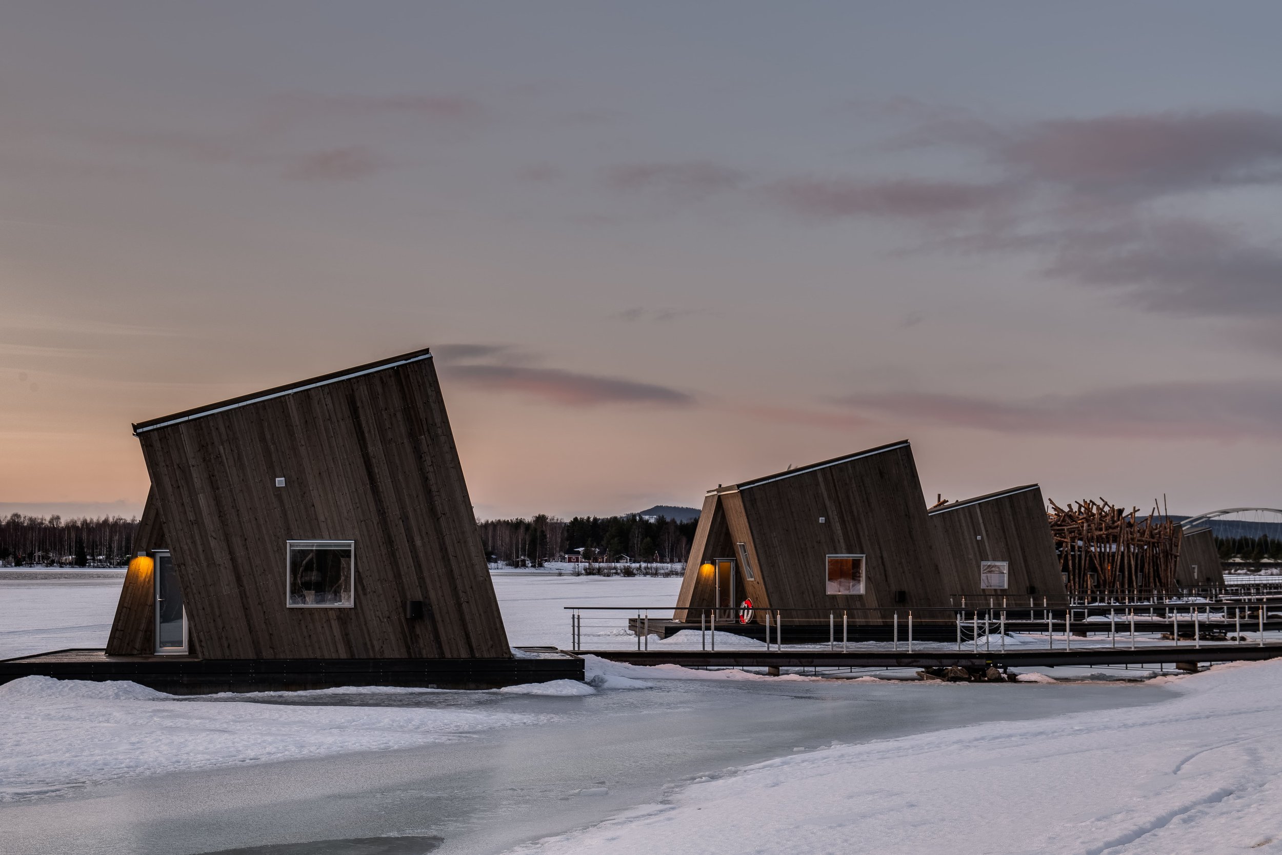 Artic bath huts at night