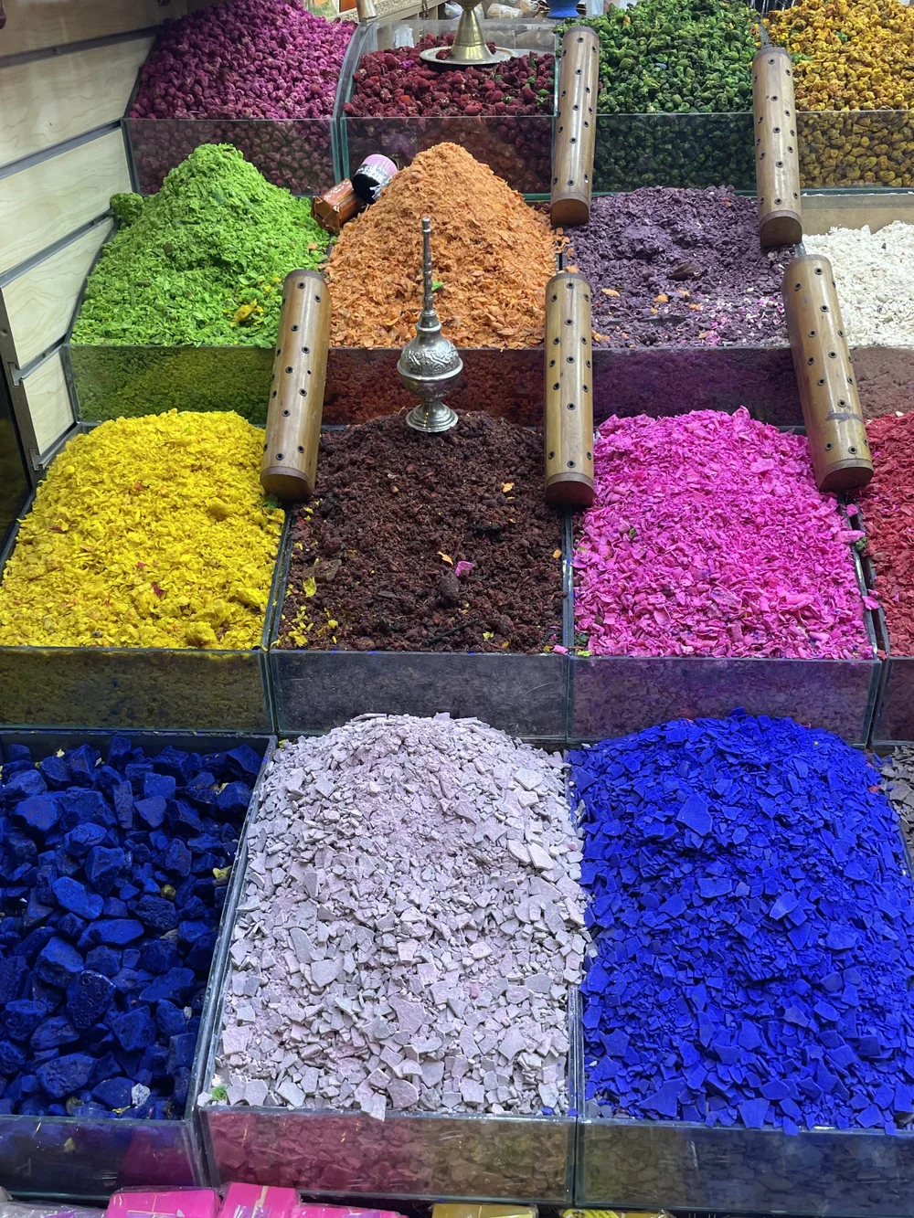 spices in bright colours such including blue, pink and green