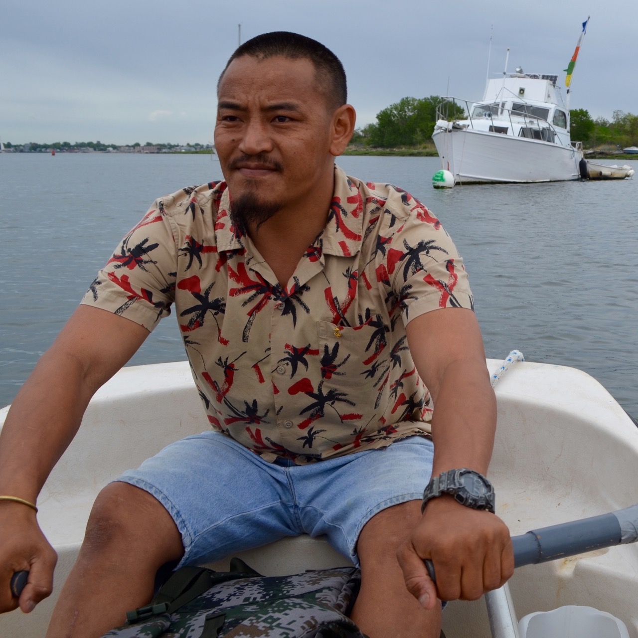 Nepal native Gigmy Bista has to row to shore from his City Island houseboat for fresh water. The lifestyle reminds him of back home.