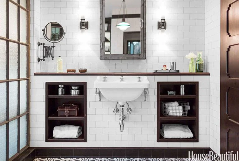 Seen here: Syre wall-mounted sink flanked by built-in cubbies