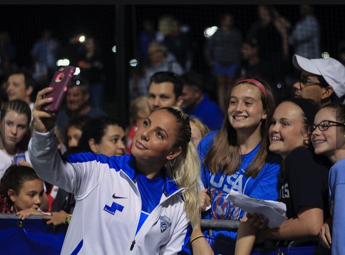Adriana Leon with fans before a game