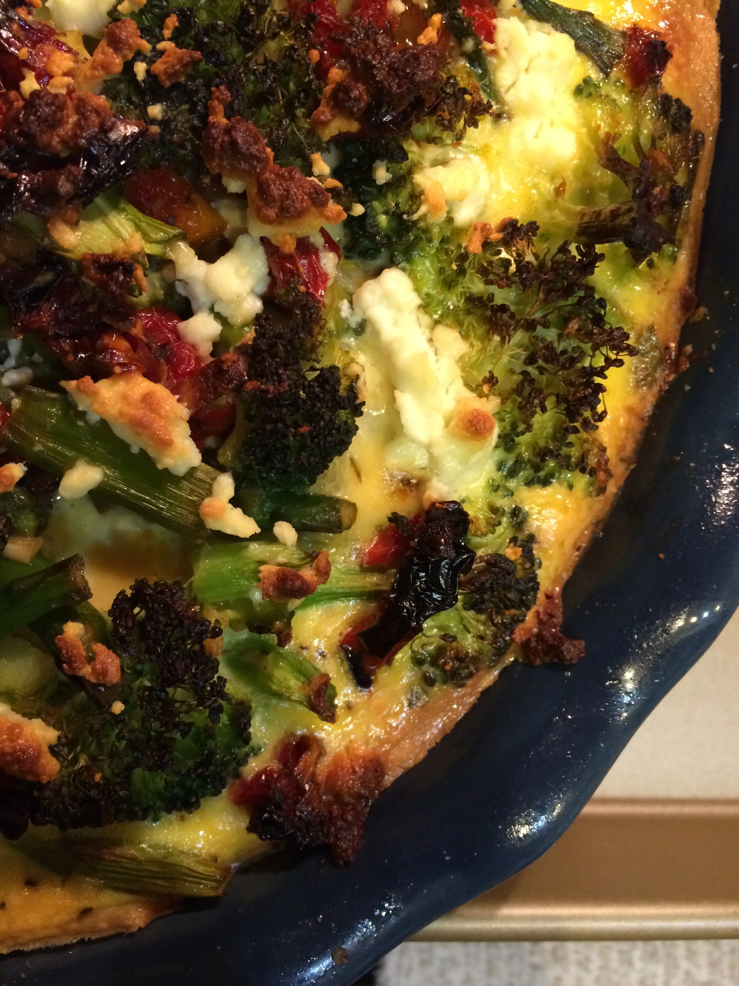 Grain-Free Spring Harvest Quiche with Sausage, Sun-dried Tomatoes and Goat Cheese.