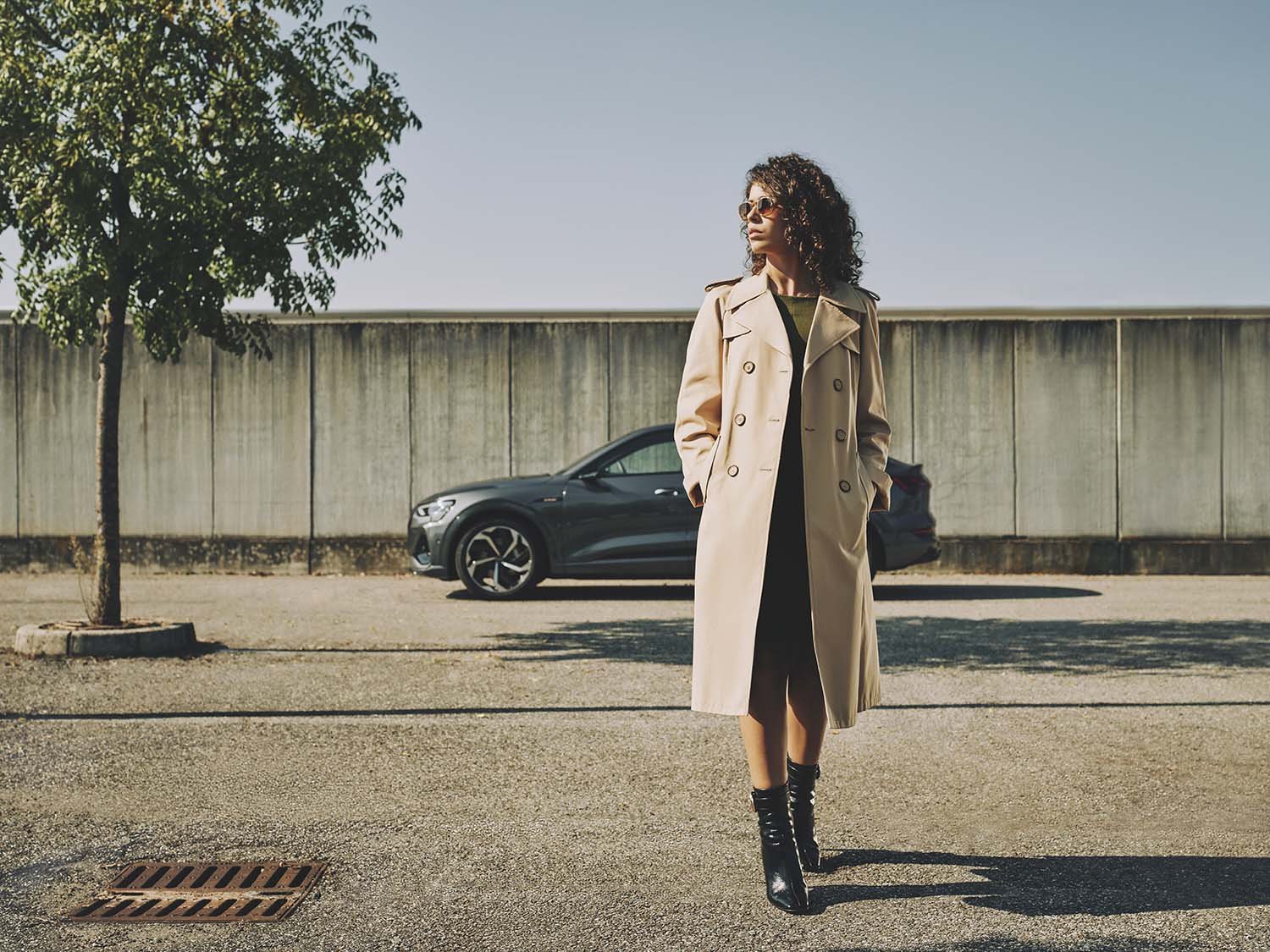 a model with an Audi e-tron in Milan