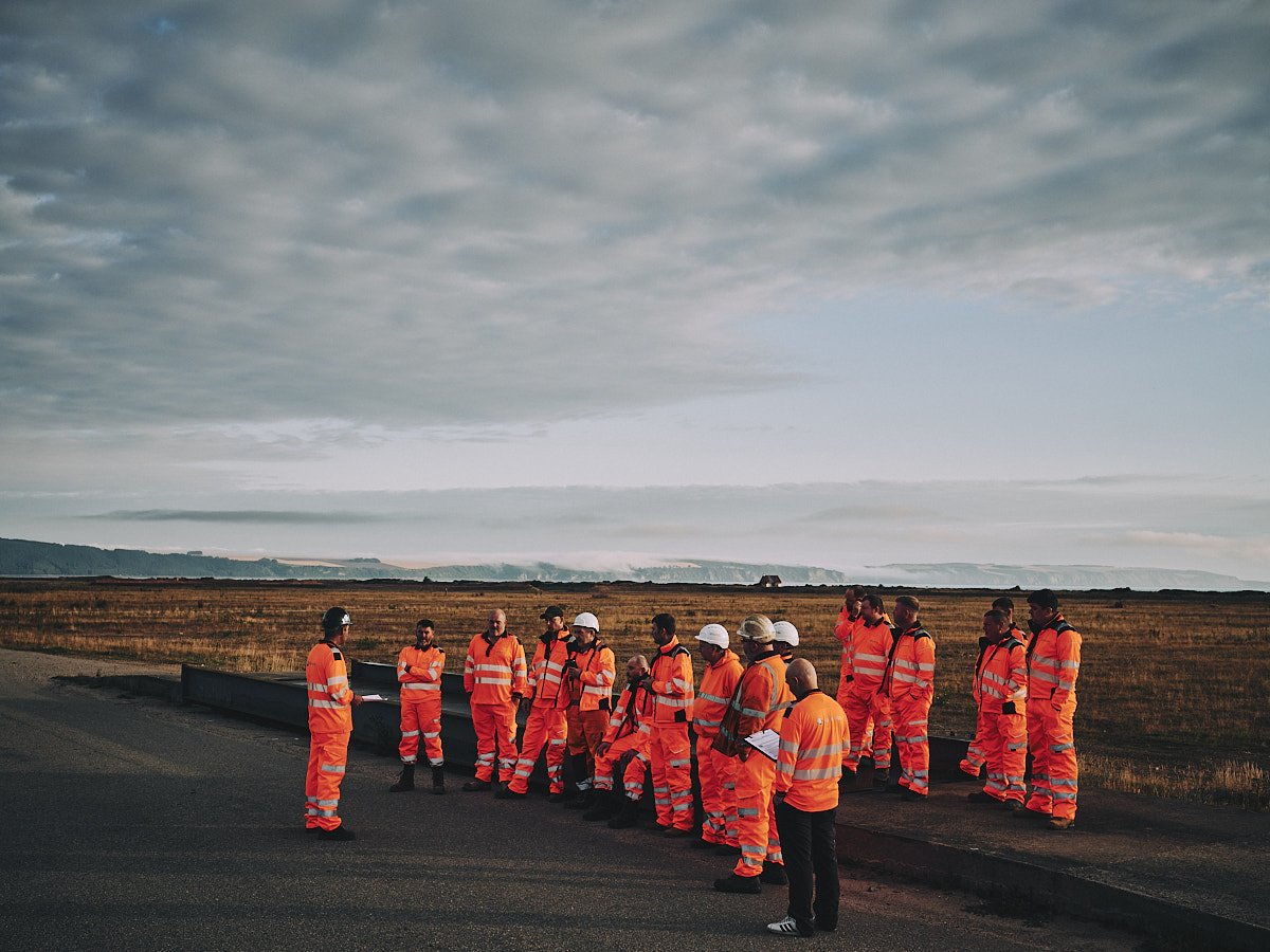 industrial workers attend a site meeting in this photograph by offshore photographer Matthew Lloyd
