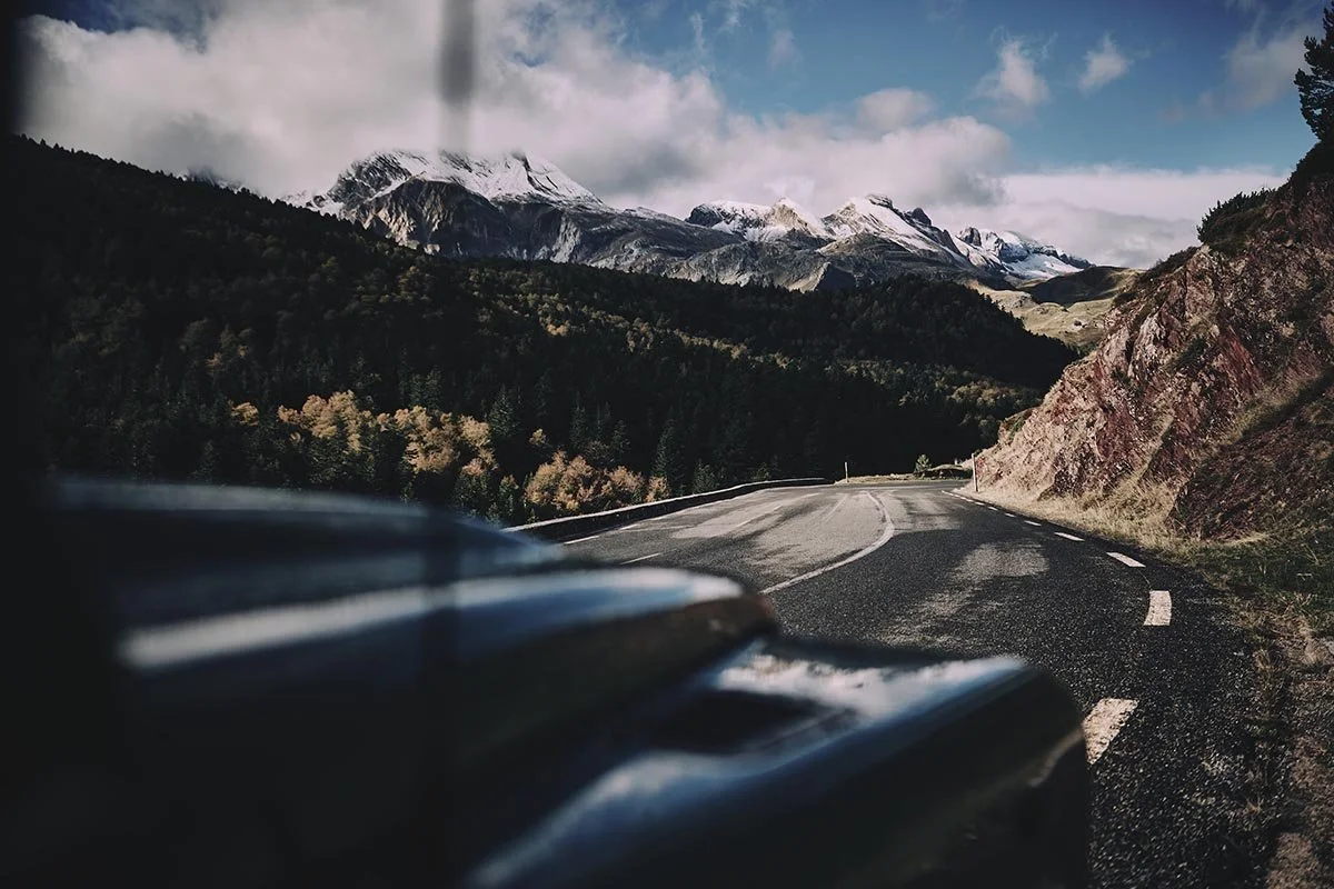 views of the pyrenees over the Bonnet of a Land Rover defender by photographer Matthew Lloyd