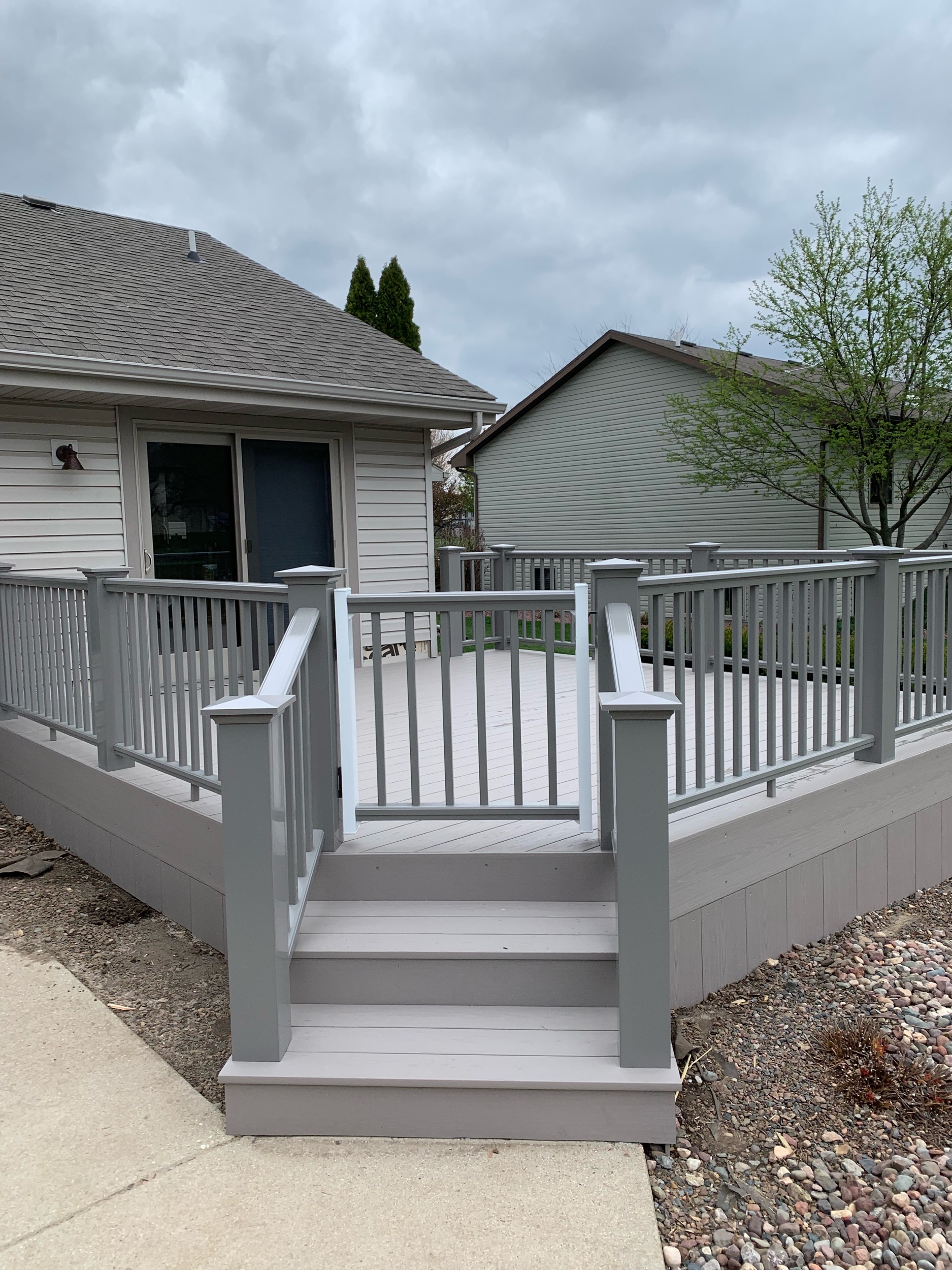 Azek Slate grey deck boards, balusters, and railing.