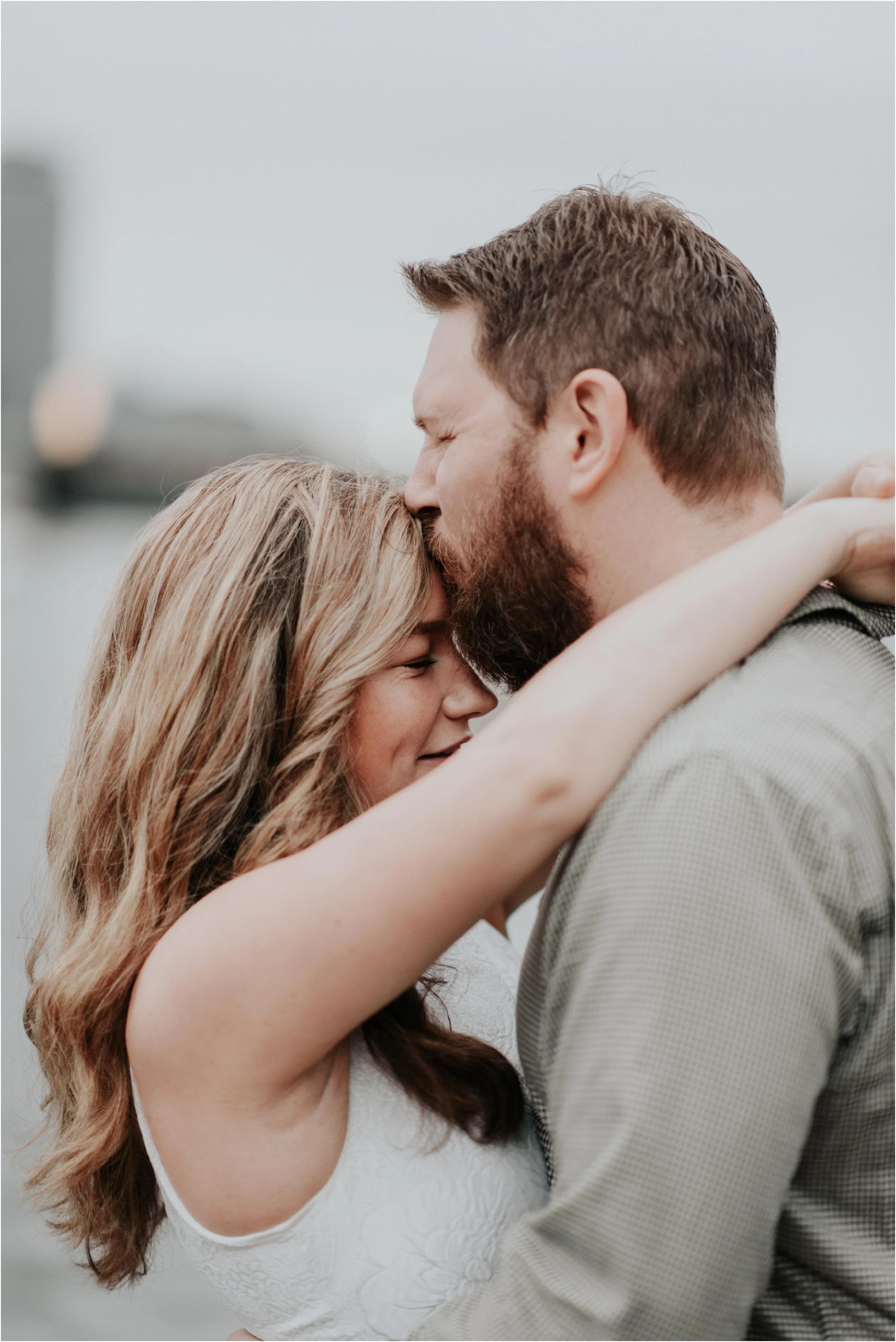It's not often I get a couple to agree to a sunrise session, but Cameron and Michael were on Dublin time, so this was just another morning for them! We wanted to capture their neighborhood in Cambridge and the best fall foliage New England has to offer, before their big move across the pond this winter. Not only are Cameron and Michael getting ready to move to Dublin indefinitely, they're also planning their Boston wedding for this May. It's going to be a huge year for the two of them, so I wanted to give them a break from all of their planning and document their lives together, just as they are, right now. Our day started in the dark, with three dark roasts: just cream for me and Cameron, cream and sugar for Michael. Once I saw Cameron's gorgeous white dress from Rent-The-Runway, I knew we were going to have the best morning!! Their neighborhood in Cambridge is one of my favorites, super close to the Charles River with lots of classic brick sidewalks and city skyline views. Five years ago I worked on office job in that neighborhood, and I wish I could go back and tell my past-self everything the future had in store! After the sun was up, we headed down to the Arnold Arboretum of Harvard University and had a blast, and breathing in the new, crisp fall air. Cameron and Michael, I had the sweetest morning with you two. And if we could have that much fun at sunrise, I can only imagine how much fun your wedding will be in May! xo Mads